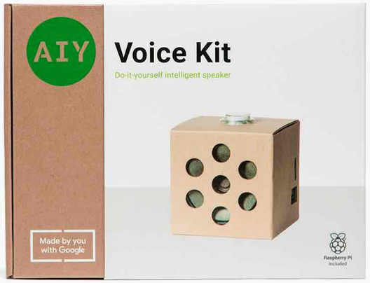 Коробка AIY Voice Kit, "Do-it-yourself intelligent speaker", "Made by you with Google", "Raspberry Pi included", картонный кубик с кнопкой наверху и семью круглыми вырезами на передней грани в форме шестиугольника